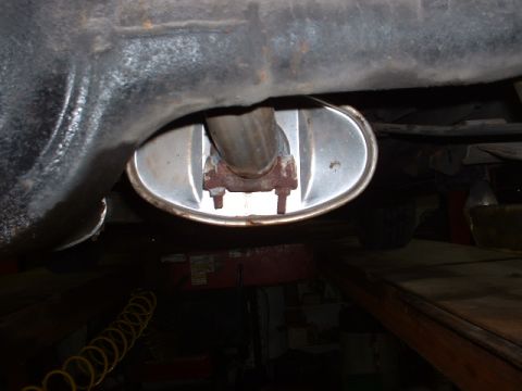 1978 Ford Mustang II - Underside view of an exhaust system part, likely a muffler and pipe.