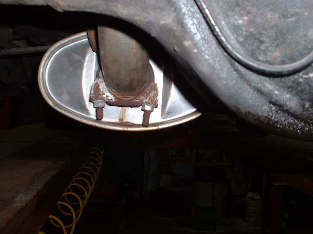 close-up of car exhaust pipe and muffler connection