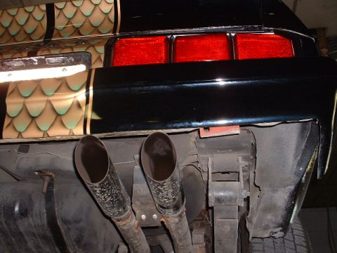 1978 Ford Mustang II - Underside view of a vehicle's dual exhaust system and rear suspension components.