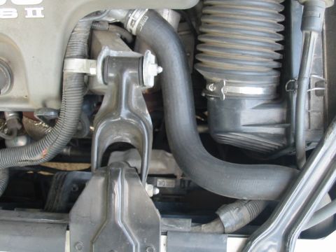 1997 Pontiac Grand Prix - The image shows various engine components, including hoses and the air intake system.