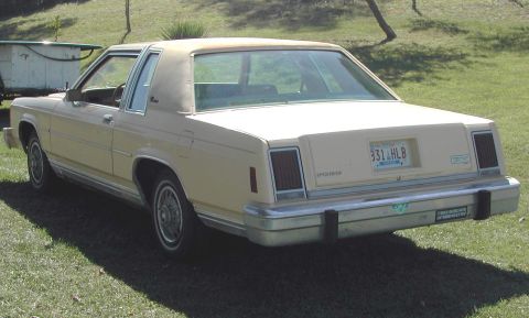 1985 Ford LTD Crown Victoria - This 1980s Ford sedan has a vinyl roof and chrome bumper details.