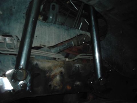 1978 Ford Bronco - Close-up view of the undercarriage, showing suspension parts and frame structure.
