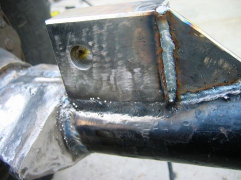 1985 Ford Bronco - Close-up view of a custom welded metal bracket, likely part of a suspension or frame modification.