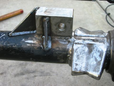 1985 Ford Bronco - This image shows a close-up view of a custom-welded axle housing, likely for a vehicle modification.