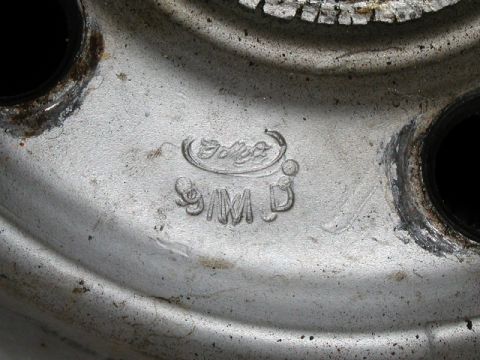 1967 Ford Ranchero - A silver Ford wheel shows the manufacturer's logo and casting details.