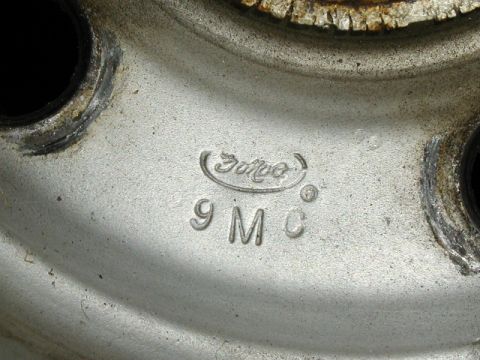 1967 Ford Ranchero - Close-up of a Ford wheel showing the '9MC' casting mark.