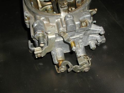 1967 Ford Ranchero - Close-up view of a metal carburetor with visible mechanical components.