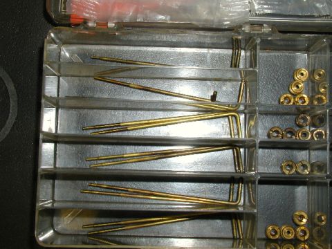 1967 Ford Ranchero - A close-up view shows a variety of small metal parts organized within a clear plastic container.