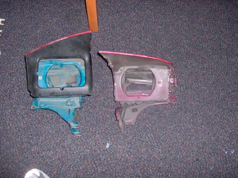 1994 Ford Probe - Two car headlight assemblies are shown on a carpeted floor.