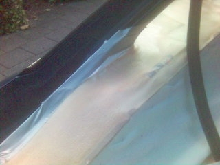 1994 Ford Probe - The interior of a vehicle is covered with protective plastic sheeting, and a SuperMotors.net logo is visible in the lower right corner.