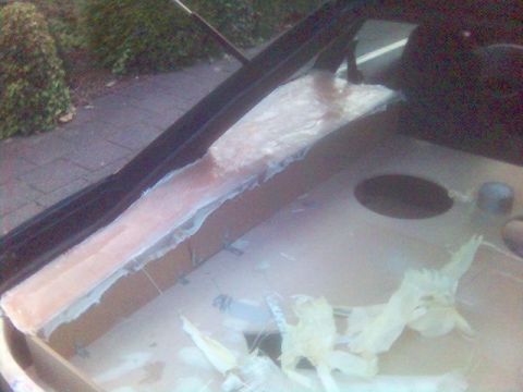 1994 Ford Probe - Work is underway to repair a section of the car's interior, with materials laid out for application.