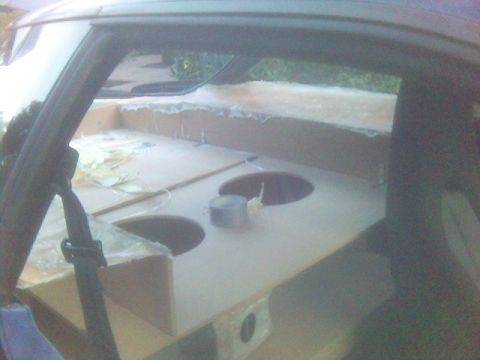 1994 Ford Probe - Interior view of a car's rear deck modified with a custom speaker box.