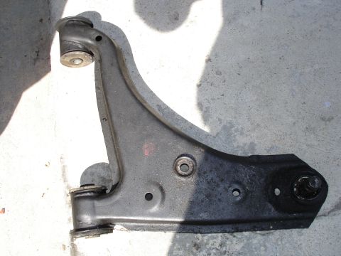 1989 Mazda MX-6 - This is a single automotive suspension control arm, likely for the front suspension.