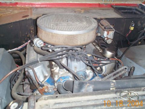 1974 Ford Bronco - Close-up view of the engine compartment, highlighting the V8 engine and its components.
