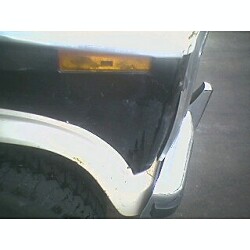 1981 Ford Bronco - Close-up of the front corner of a 1981 Ford Bronco, showing the turn signal and fender.