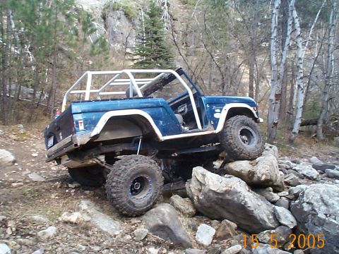 1977 Ford Bronco - This modified 1977 Ford Bronco navigates a rocky trail with a custom roll cage.