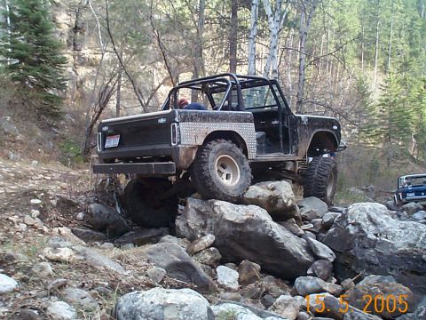 1977 Ford Bronco - This modified 1977 Ford Bronco is shown off-roading over a rocky terrain.