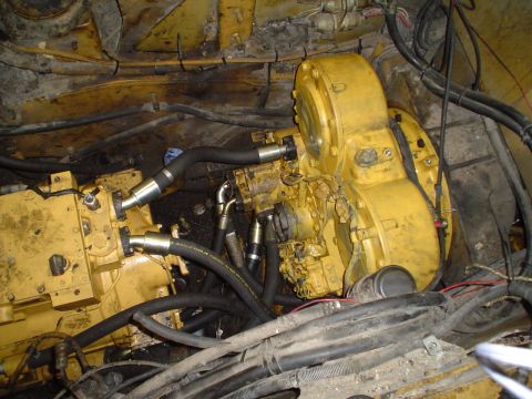 1966 International School Bus - Close-up view of complex machinery and wiring within an engine bay.