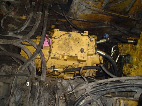 1966 International School Bus - Close-up view of yellow engine components and numerous hydraulic hoses.