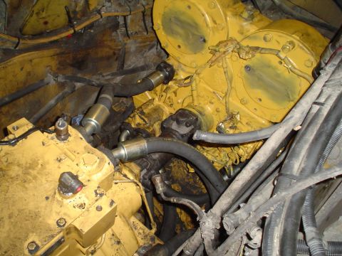 1966 International School Bus - Engine compartment details with yellow machinery and various hoses visible.