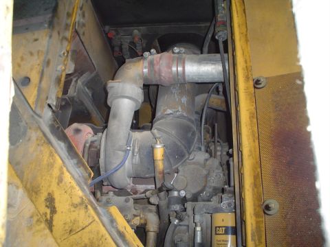 1966 International School Bus - Close-up view of an engine compartment, highlighting the turbocharger and associated plumbing.