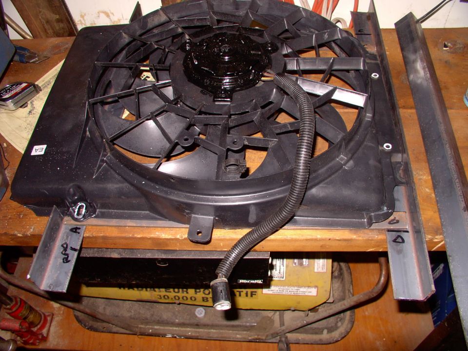 The Taurus fan sits on the steel to check for fit and to allow me to drill locating holes for the 4 stock Taurus shroud mounting holes.