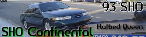 1993 Ford Taurus - This 1993 Ford Taurus SHO is seen on a flatbed truck, with text overlay identifying it as 'Flatbed Queen'.