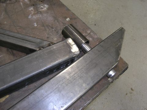 2001 Jeep Wrangler - Fabricated metal bumper parts are laid out on a workbench, ready for assembly.