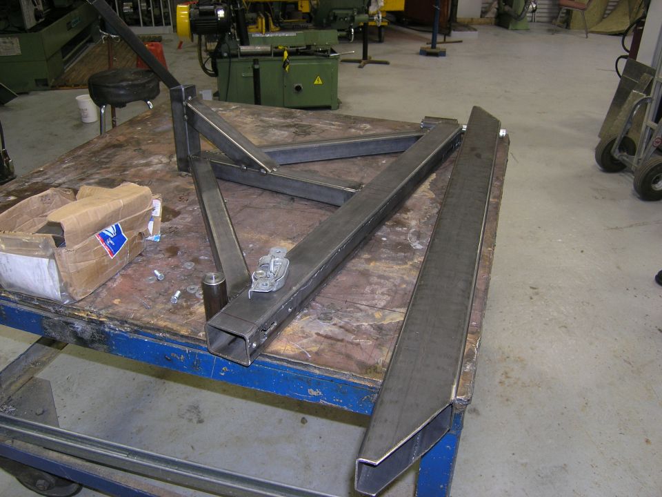 Metal bumper parts on a workbench