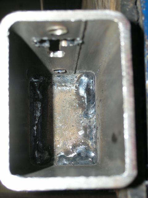 2001 Jeep Wrangler - Close-up of the inside of a metal tube showing weld seams and a bolt hole.
