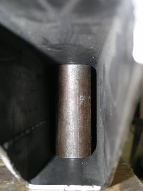 2001 Jeep Wrangler - A metal rod is shown inserted into a hollow, dark-colored frame, likely a component of a larger structure.
