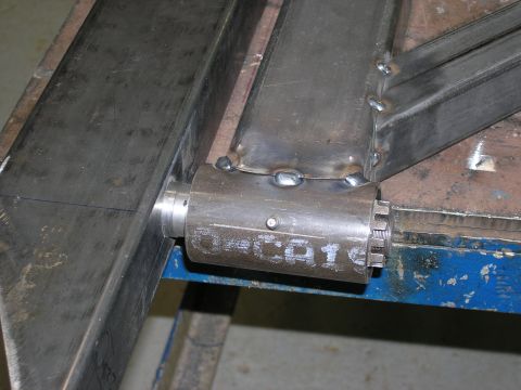 2001 Jeep Wrangler - Close-up of a metal bracket with a bolt and nut assembly, showing welded joints.