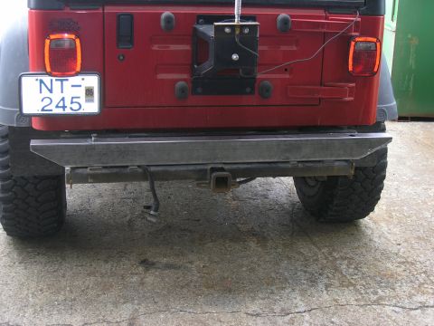 2001 Jeep Wrangler - Rear view of a 2001 Jeep TJ showing an aftermarket bumper and spare tire mount.