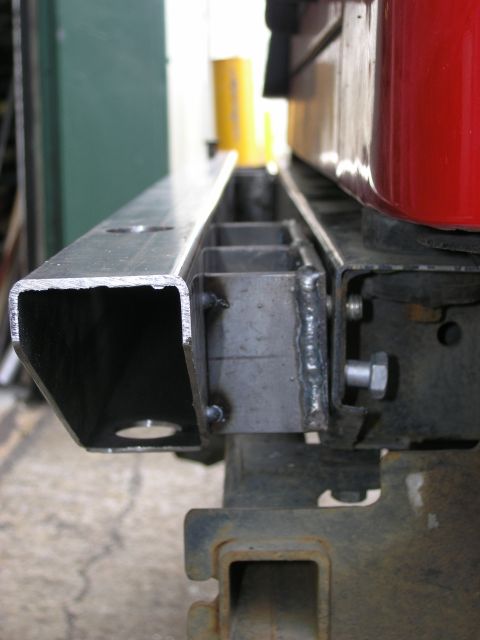 2001 Jeep Wrangler - Close-up of a custom metal bumper bracket, showing welded construction and mounting hardware.