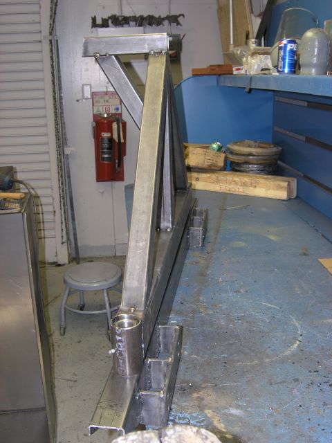 2001 Jeep Wrangler - Unfinished metal fabrication project in a workshop setting, with tools and supplies in the background.