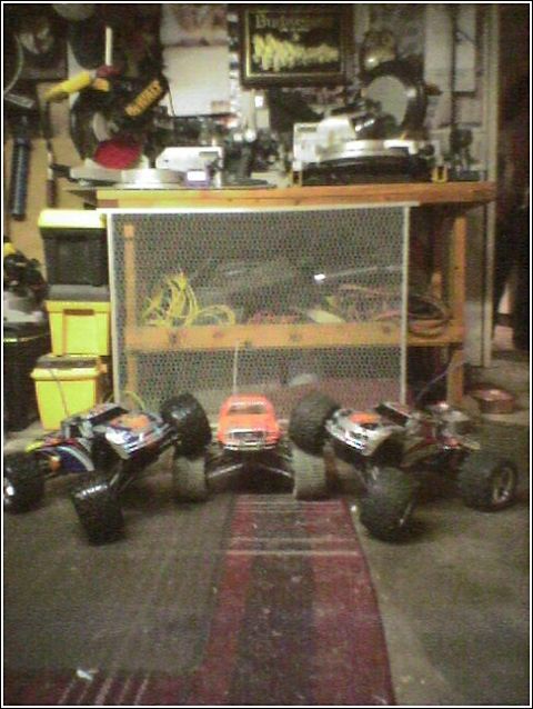 1993 Ford Bronco - Collection of RC vehicles including monster trucks and a small car.