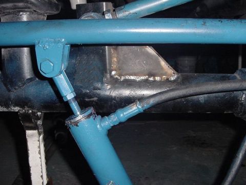 1971 Ford Bronco - Close-up view of modified vehicle suspension components, including a hydraulic cylinder and hose, with visible text from Supermotors.net.