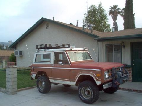 1973 Ford Bronco - This 1973 Ford Bronco features a two-tone paint scheme, roof rack, and a front-mounted winch.