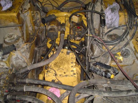 1966 International School Bus - Close-up view of a complex engine compartment with many hoses and wires.