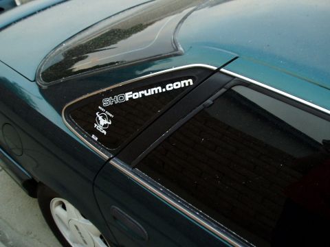 1995 Ford Taurus - A sticker on the rear quarter window of a 1995 Ford Taurus SHO indicates it's part of the SHOForum.com community.