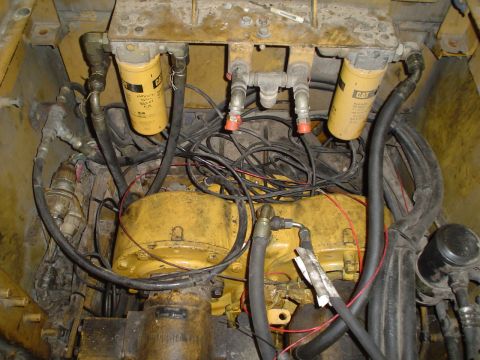 1966 International School Bus - Close-up view of an engine compartment, showing filters, hoses, and wiring.