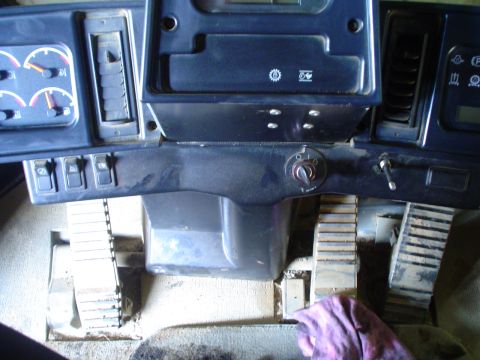 1966 International School Bus - The interior of a vehicle shows tracks instead of wheels, with gauges and controls visible.