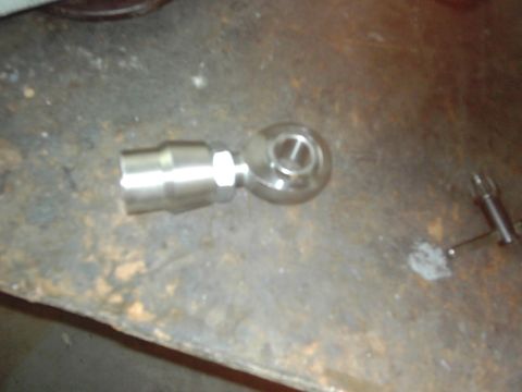 1978 Ford Bronco - A close-up of a metal rod end joint, likely a replacement part for a vehicle's suspension or steering system.