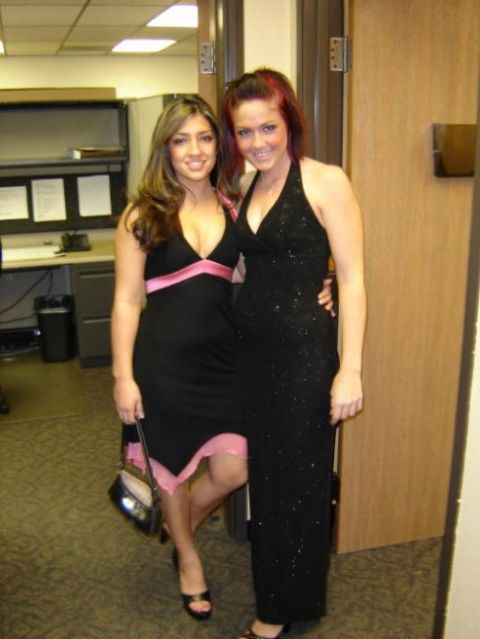 2004 Ford F-150 - Two women pose for a photo in formal attire, standing in what appears to be an office environment.