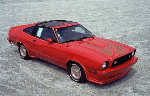 1978 Ford Mustang II - This red 1978 Ford Mustang II coupe features a black t-top roof and distinctive hood graphics.