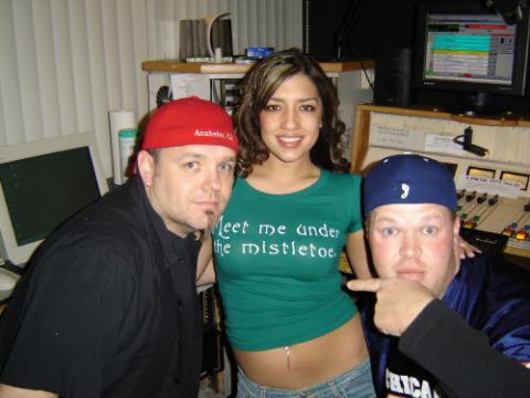 2004 Ford F-150 - People pose in a studio setting with audio equipment and computer screens visible.