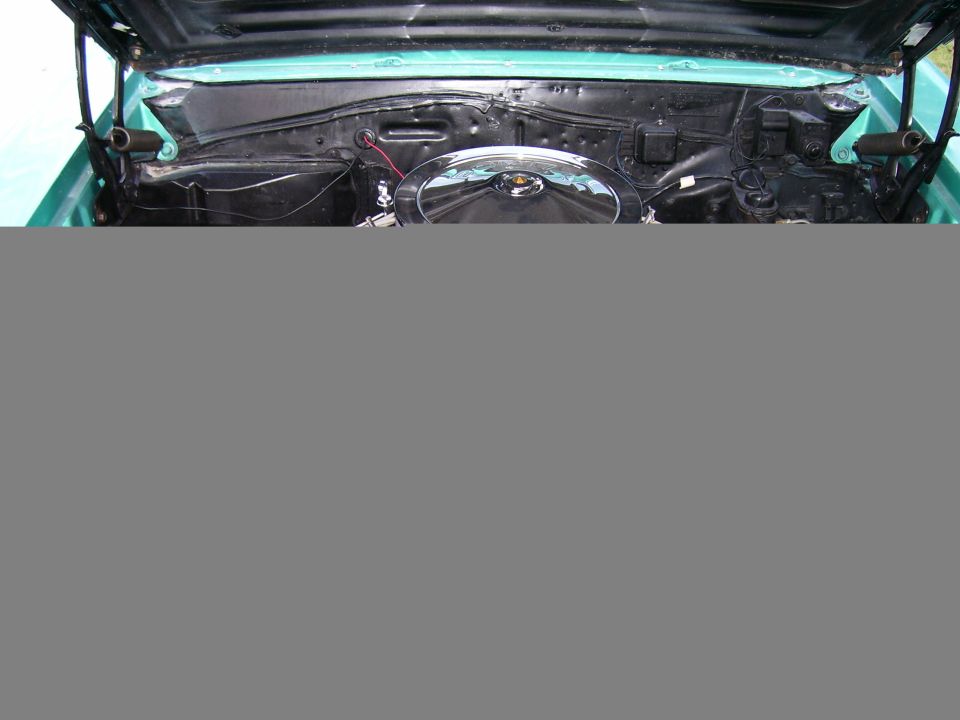 Teal 1967 Pontiac Lemans engine bay with chrome air cleaner and visible wiring
