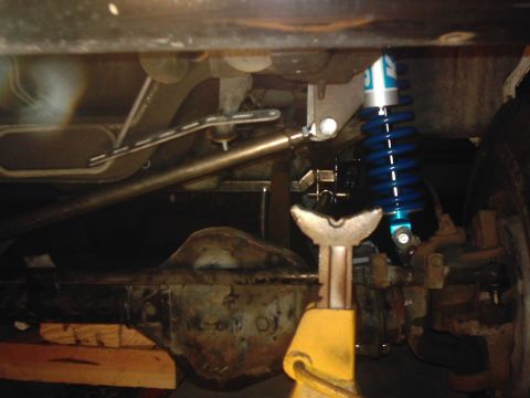 1978 Ford Bronco - Undercarriage components including a differential and a blue coilover shock absorber are visible.