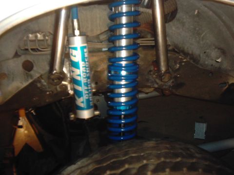 1978 Ford Bronco - Close-up view of aftermarket suspension components, including King Off-Road Racing Shocks, mounted on a vehicle.