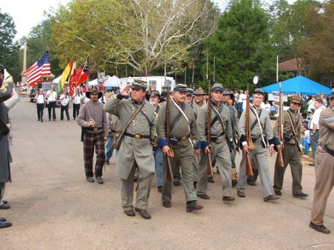 1966 Ford Ranchero - Reenactors dressed in Civil War era uniforms march in a parade, holding rifles and flags.